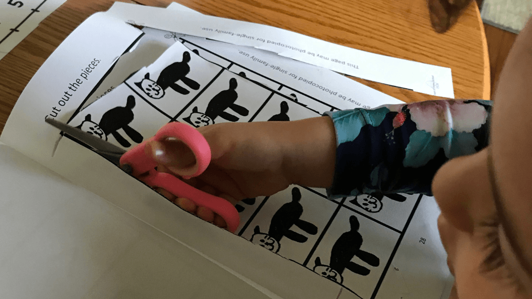 Child Cutting Paper